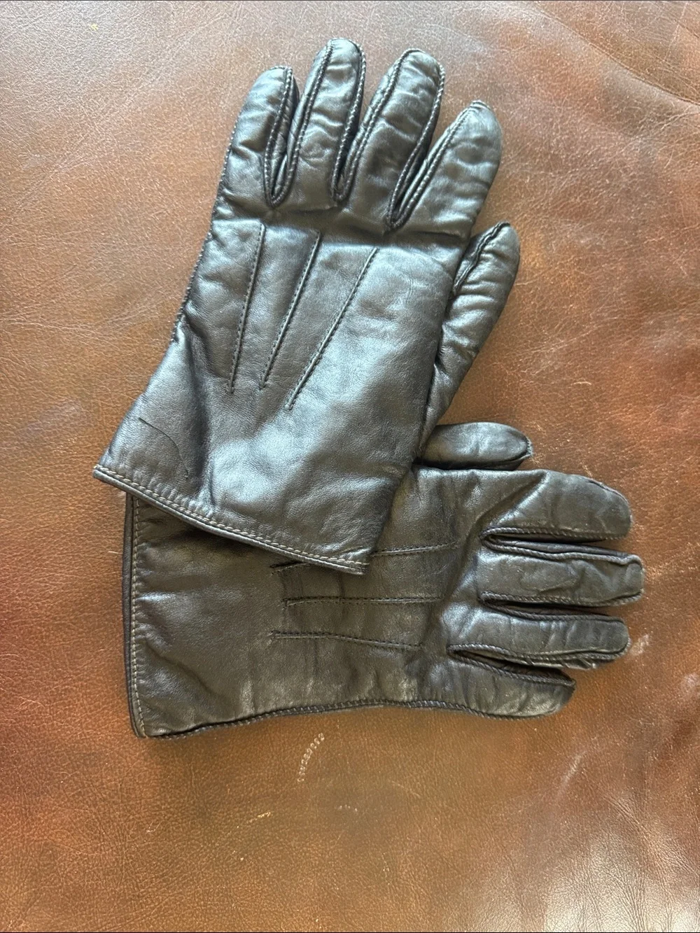 Genuine black leather gloves with genuine fur lining. Size medium